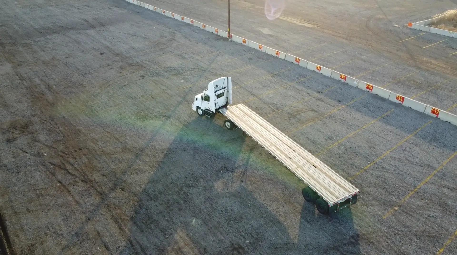 Semi-truck training exercise at the All-In CDL yard during a golden-hour session