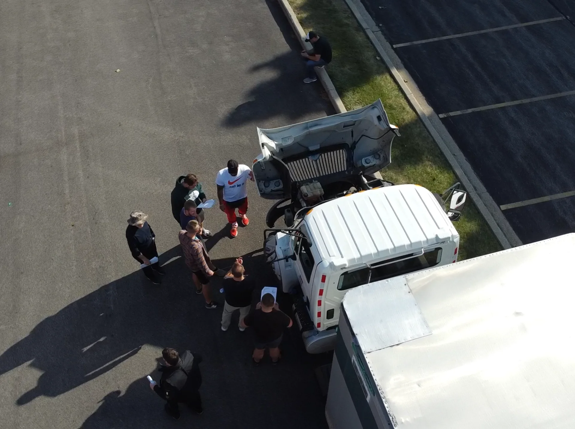 All-In CDL students and an instructor performing a pre-trip inspection at the Zion training yard
